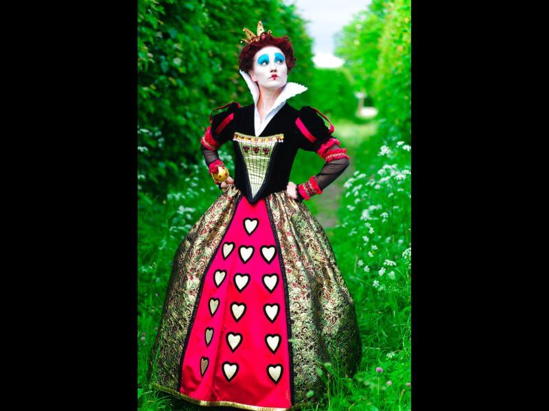 The fairy tale Queen of Hearts in a garden.