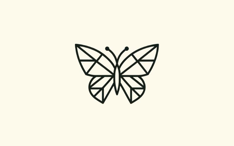 A geometric butterfly tattoo wrist tattoo.